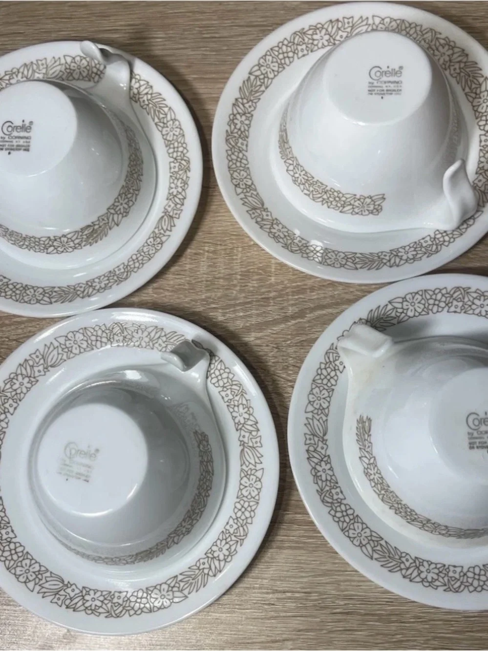 Set of (4) corelle pyrex coffe cups with saucers “woodland ” hook handles